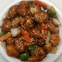Sesame Chicken · Served with fried rice, choose egg roll or 2 crab rangoons.