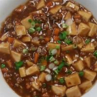 Ma Po Tofu · Spicy. Soft tofu with chopped pork in a spicy brown sauce. Served with fried rice and white ...