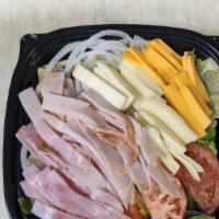 Gourmet Chef Salad · Served with ham, turkey, American, mozzarella cheese on top of our garden salad.