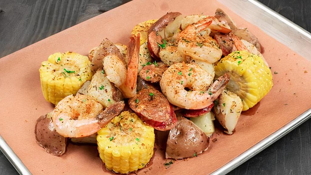 Southern Cajun Shrimp Boil · Tender, succulent boiled Shrimp and fresh Red Potatoes tossed with grilled Sausage and corn, in house-made Cajun Butter and our very own Cajun Seasoning blend.