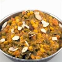 (Navaratna) Korma · Mixed vegetables cooked in a creamy sauce and flavored with herbs and spices.