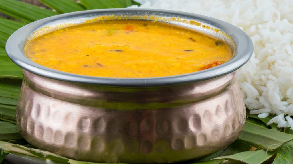 Daal Tadka (Yellow Dal) · Yellow lentil cooked with ginger, garlic, tomato, onion sauce, and Indian spices.