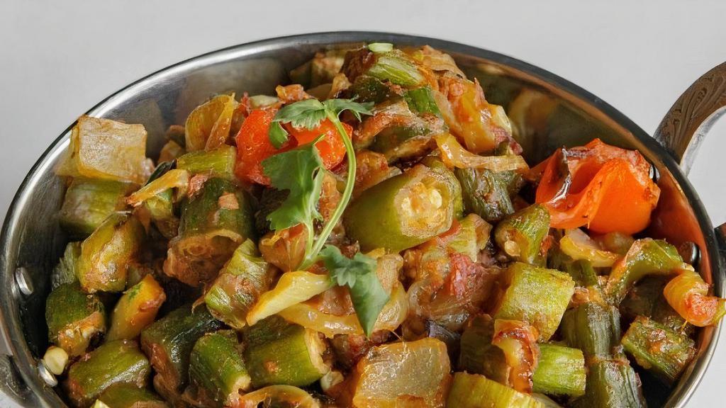 Bhindi Masala · Fresh okra lightly sautéed with onions, spices, tomatoes, and bell peppers.