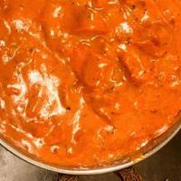 Chicken Makhani (Butter Chicken) · A delicious preparation of oven roasted chicken cooked in an exquisite creamy tomato sauce.