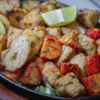 Mix Grill (Sampler Of Above) · Combination of sizzling tandoori specialties: chicken tikka, seekh kabab, achari chicken, an...