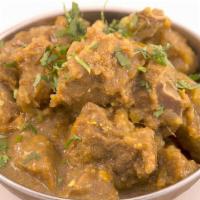 Goat Curry (With Bone) · Cubed goat (with bone) cooked in onions, tomato, garlic, and ginger and deliciously flavored...