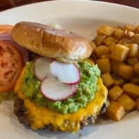 Guacamole Burger · Our take on an American classic. A juicy burger topped with Cheddar cheese, onion, tomatoes ...