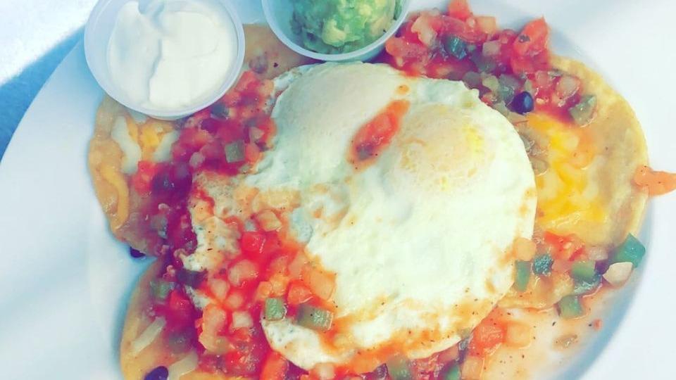 Huevos Rancheros · Two eggs, served with fried tortilla shells, chorizo, black beans, onion and green peppers, topped with mix cheese, salsa, sour cream, fresh jalapeños, onions. Served with a side of guacamole.