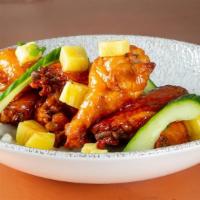 Caribbean Chicken Wings (Sweet Heat) · House Caribbean, sauce, grilled pineapple, scallion, cucumber.