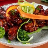 General Tso Fried Wings (Mild Heat) · Spicy. Steamed broccoli. Candied orange.
