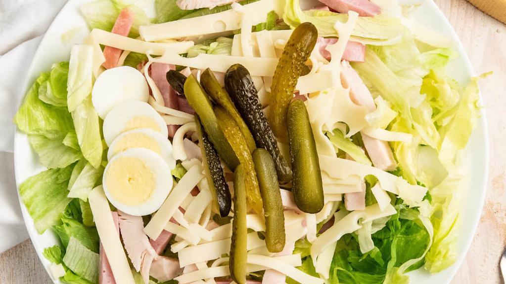 Hudson’S Maurice Salad · Iceberg lettuce, ham, turkey, Swiss cheese, gherkin pickles and a hard boiled egg with Maurice dressing. Served with a slice of bread.