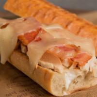 Chicken Focaccia Sandwich · Baked chicken breast, bacon, Swiss cheese and ranch dressing on focaccia. Served with a pick...