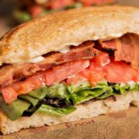 Blt Sandwich · Bacon, fresh lettuce, tomato and mayo on sourdough bread. Served with a pickle and choice of...