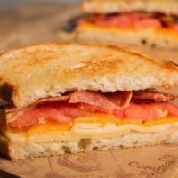 Gt Grilled Cheese Sandwich · Cheddar cheese, havarti cheese, bacon and tomato on sourdough bread. Served with a pickle an...