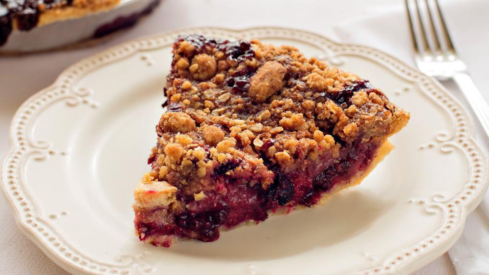 Mountain Berry Crumb · A blend of Michigan Rubel blueberries, raspberries, blackberries, and ripe red strawberries in our flaky crust. Then our fabulous toasted crumb topping is embellished with oatmeal and brown sugar to make this pie extra flavorful. A warm slice of this pie will keep you toasty on any of Michigan’s slopes.