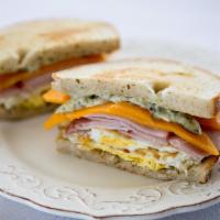 Breakfast Sandwich With Bacon · Sourdough, cheddar, bacon, pesto mayonnaise and eggs.