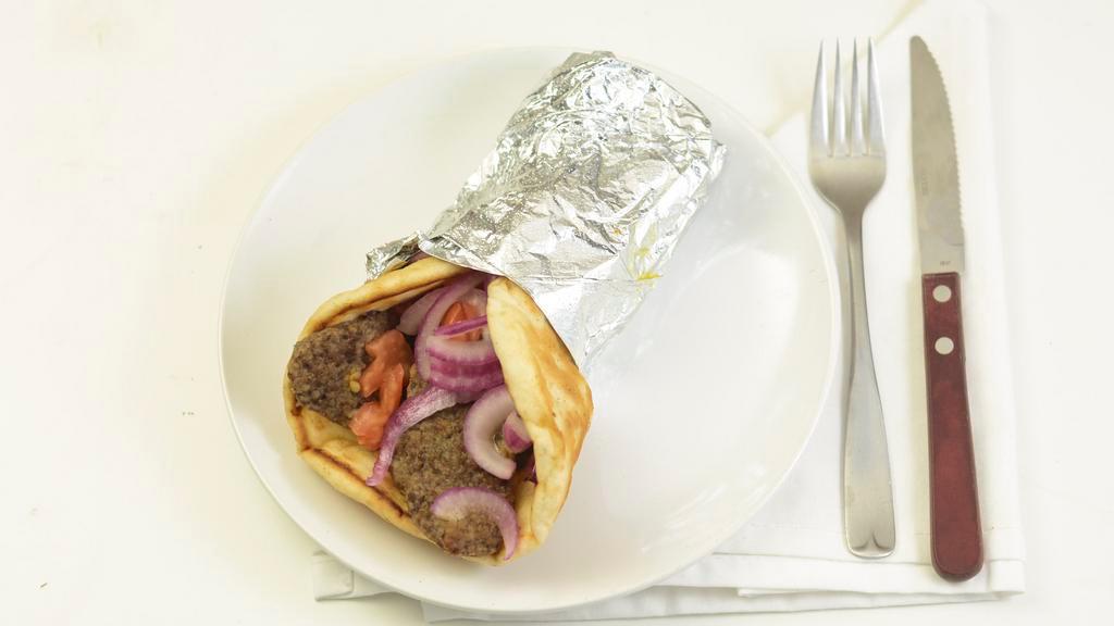 Gyro Pita · Seasoned beef with tomato and onion in a pita. Tzatziki sauce on the side.