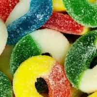 Assorted Gummi Rings · A mix of our sanded gummi rings. Depending on availability, flavors may include cherry, peac...