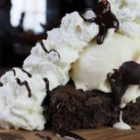 Brownie Sundae · Warm old fashioned brownie topped with vanilla ice cream. Finished with whipped cream, choco...