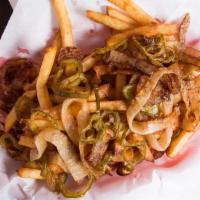 Small Spanish Fries · Fresh cut fries (Tossed in our 'Ron's Seasoning Salt') topped with fried onions and jalapeños.