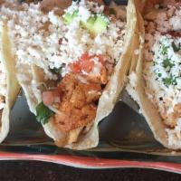 Tacos Monterrey · Grilled chicken, pico de gallo, sliced avocado, queso fresco on three corn tortillas. Side o...
