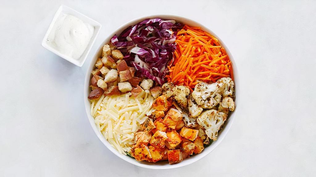 The Bold & The Buffalo · brown rice, arugula, buffalo chicken, carrot, radicchio, white cheddar, roasted cauliflower, croutons** and C&G ranch dressing (630 cal)