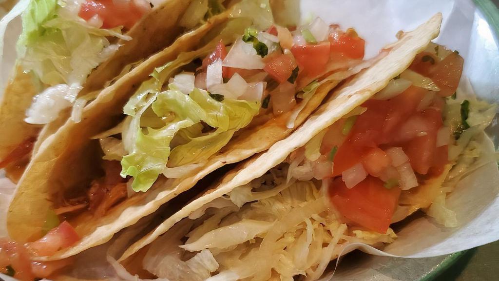 Real Mexican Tacos · Soft yellow corn tortillas stuffed with your choice of grilled steak, grilled chicken, chorizo, al pastor or carnitas; topped with onions and cilantro.