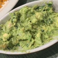 Guacamole · Made fresh at time of order, our delicious blend of avocado, onions, cilantro and fresh lime...
