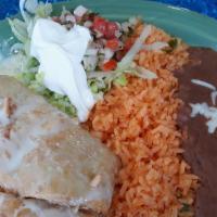 Chimichanga · A chimichanga stuffed with ground beef of shredded chicken, then deep-fried and topped with ...