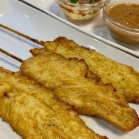 Chicken Satay (ไก่สะเต๊ะ) · Delicious Chicken Satay or grilled chicken skewers. Marinated with spices. served with peanu...