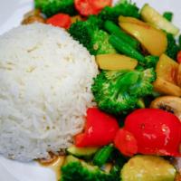 Mixed Veggies Stir-Fried (ผัดผักรวมมิตร ราดข้าว) · A main healthy dish served with Jasmine rice. Broccoli, carrot, onion, bell pepper, green be...