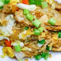 Thai Fried Rice (ข้าวผัด) · Jasmine rice, egg, diced carrot, pea, and onion. Stir-fried in our homemade sauce. Served wi...