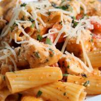 Spicy Rigatoni · Rigatoni pasta sautéed with garlic, red peppers and a spicy tomato cream sauce.