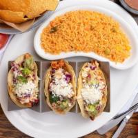 Cucos Tacos Locos · Three corn or flour taco shells spread with guacamole and filled with marinated chicken stri...