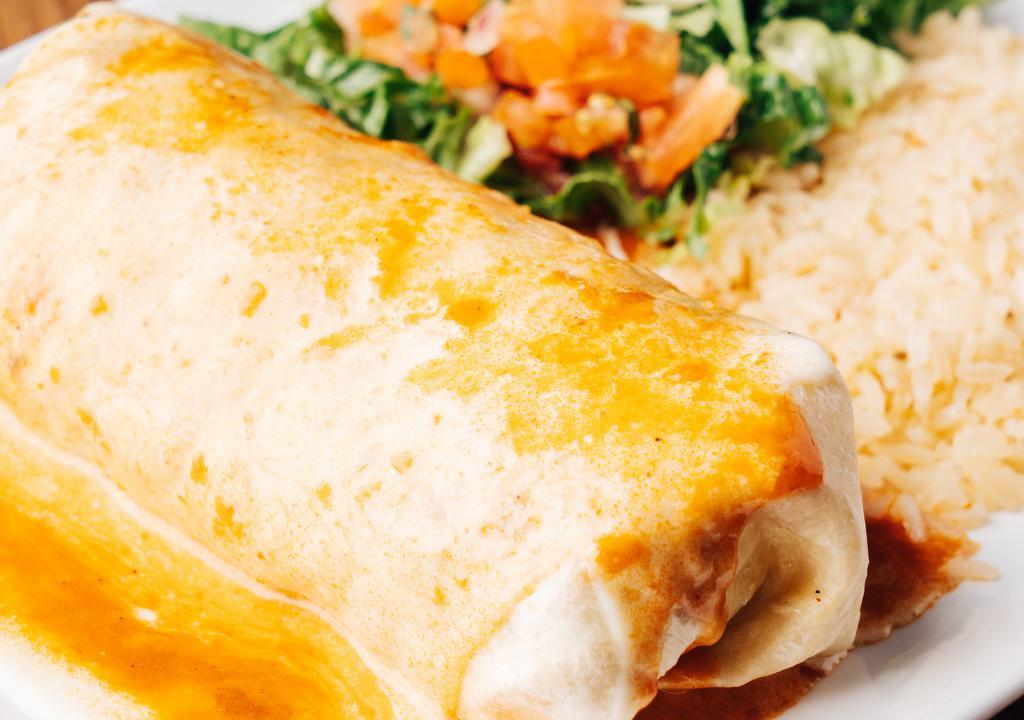 Burrito Tres Potrillos · Big burrito filled with grilled chicken and chorizo, topped with enchilada and cheese sauce, served with Mexican rice, lettuce, sour cream and pico de gallo.