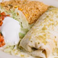 Burrito Chicago · Big burrito filled with steak, chorizo and refried beans, topped with Verde sauce and cheese...