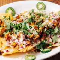 Nachos Del Rey · Nachos with grilled chicken strips, chorizo and salsa Verde, topped with cilantro, onions an...