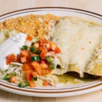 Enchiladas Verdes · Enchiladas stuffed with chicken, beef tips or cheese, topped with Verde tomatillo souce, ser...