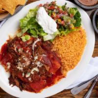 Enchiladas Rancheras · Cheese enchiladas topped with shredded pork and ranchero sauce, served with Mexican rice, le...
