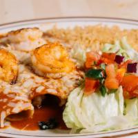 Seafood Enchiladas · Enchiladas stuffed with jumbo shrimp, scallops and spinach topped with enchilada sauce, serv...