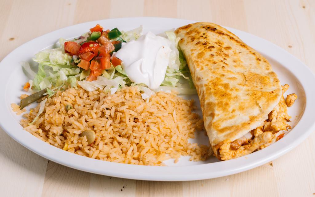 Grilled Quesadilla · Quesadilla filled with cheese and grilled chicken or steak. Served with Mexican rice, lettuce, sour cream, and pico de gallo.