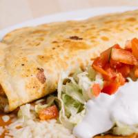 Fajita Quesadilla · A big flour tortilla stuffed with choice of steak, chicken or pork. Also filled with cheese,...