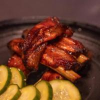 Char Sui Sticky Ribs - Spring '22 · HALF POUND OF SPARE RIBS, CHAR SUI SAUCE, SPICY SESAME GARLIC CUCUMBERS