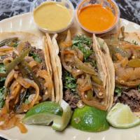 Tacos (3Pcs) · 3 Mexican Street Tacos topped with onions and cilantro.