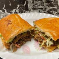 Torta · Mexican sandwich with cheese, mayo, meat of your choice, onions,  jalapeño peppers, lettuce,...