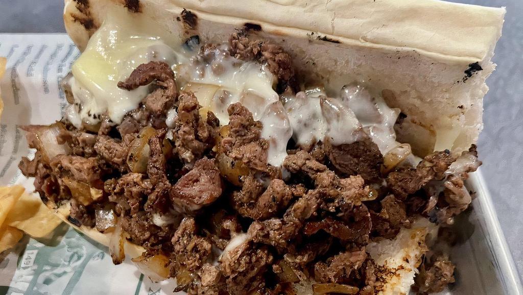 Classic Philly Footlong · House favorite with diced steak or sliced chicken, provolone, onions and green peppers on our house roll. Kick it up a little with some Cajun mayo for an additional charge.