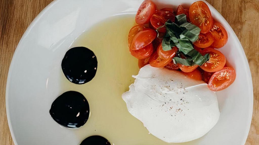 Burrata Caprese · Burrata, fresh basil, roasted grape tomatoes, extra virgin olive oil, balsamic reduction