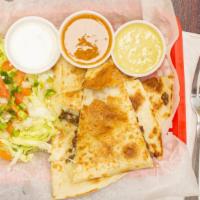Quesadillas · Chicken or ground beef. Served with guan and sour cream on the side. Add additional charge f...