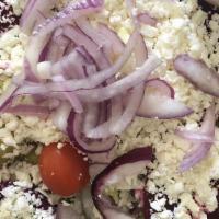 Greek Salad · Served with lettuce, beets, pepperoncini, feta, onions, Greek olives.