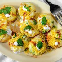 Dahi Puri (6 Pieces) · Crispy falt puris, potato and onion mix, topped with a layer of yoghurt, garnished with sev,...